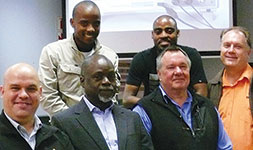 Front left to right: Darius Opperman, Comtest account manager; Prof. Josiah Munda, PrEng, associate dean of the faculty of engineering and the built environment; Hans Nel, TUT electronics technician; Barend Niemand, Comtest CEO. Back: Undergraduate students Jackson Chokoe (electrical engineering/bio-medical engineering) and Remmington Seima (electrical engineering/digital technology) who mentor, monitor and assist electronics students during lab sessions.